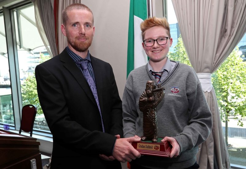 REPRO FREE. 22/05/2018 Tadhg Ò Laighin, Principal Colàiste Daibhèid, presents Rowan Eliot, 6th year with the Gradam Daibhèid Award. Colàiste Daibhèid Annual Awards, Gradaim na Scoile, at the Clayton Hotel Cork City, Lapps Quay, Cork. Picture: Jim Coughlan.